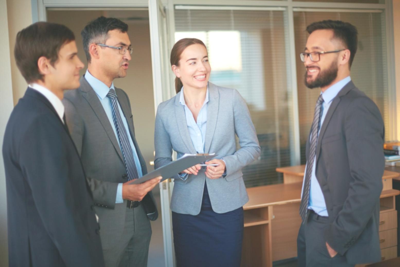 Professional presenting financial charts to business team